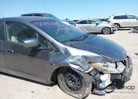 2010 Honda Insight Lx z USA, uszkodzony, nr VIN JHMZE2H58AS014625